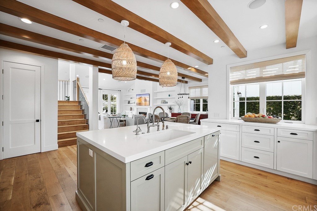355 Rochester Street Costa Mesa, CA 92627 - Photo 16 of 34 a large white kitchen with a large window