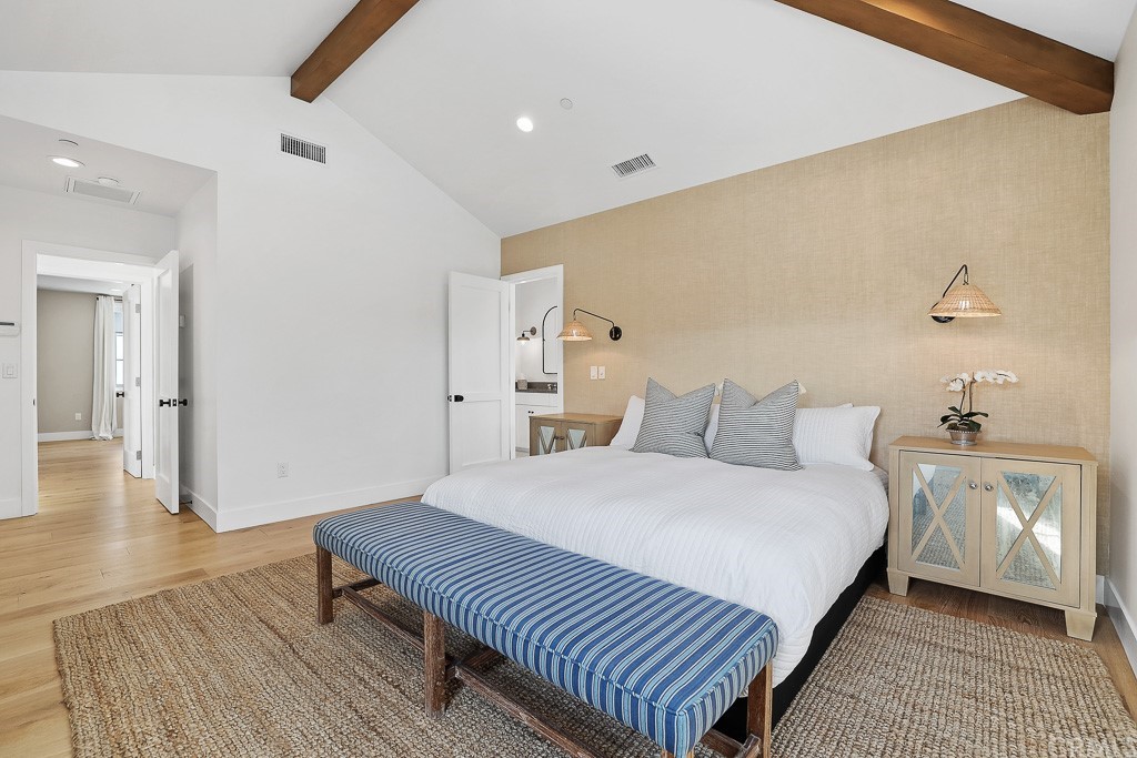 355 Rochester Street Costa Mesa, CA 92627 - Photo 23 of 34 a bedroom with a bed and a night stand