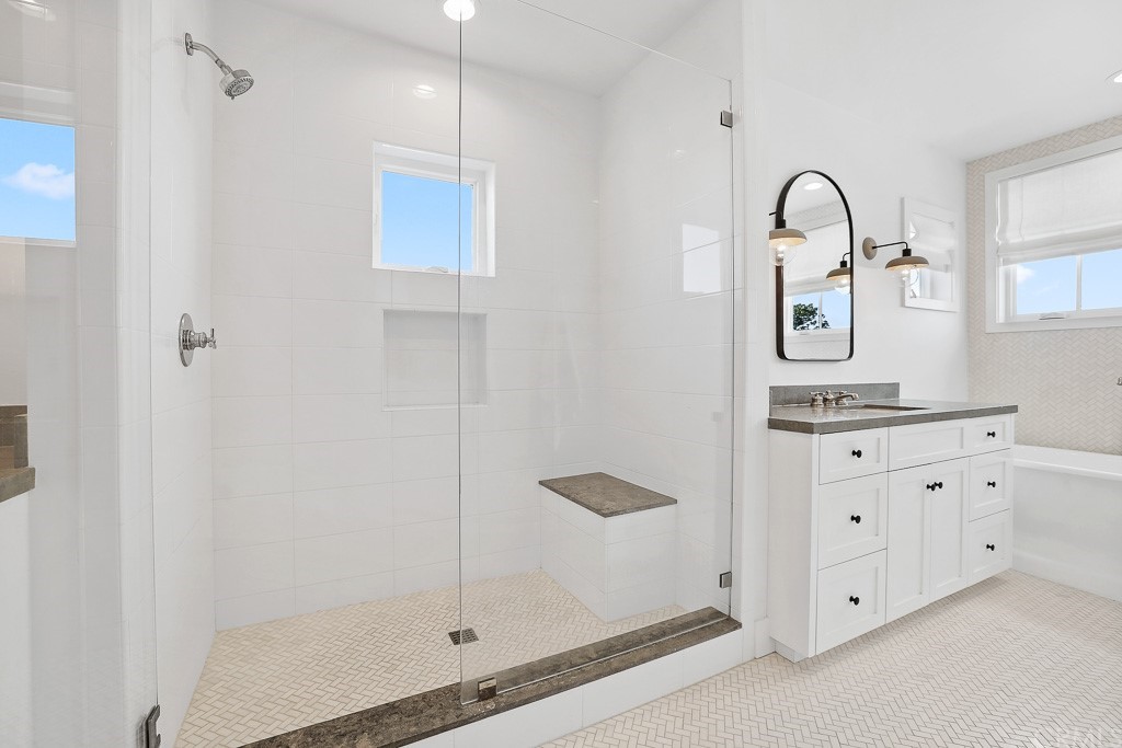 355 Rochester Street Costa Mesa, CA 92627 - Photo 25 of 34 a bathroom with a double vanity sink and mirror