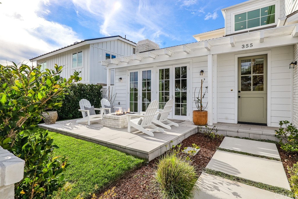 355 Rochester Street Costa Mesa, CA 92627 - Photo 3 of 34 a view of a house with backyard sitting area and garden