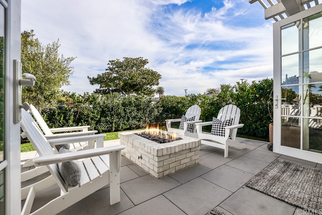 355 Rochester Street Costa Mesa, CA 92627 - Photo 31 of 34 a view of a patio with couches chairs and potted plants
