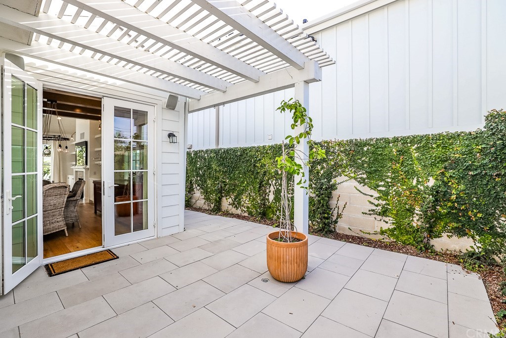 355 Rochester Street Costa Mesa, CA 92627 - Photo 32 of 34 a view of an outdoor space with a patio and garden