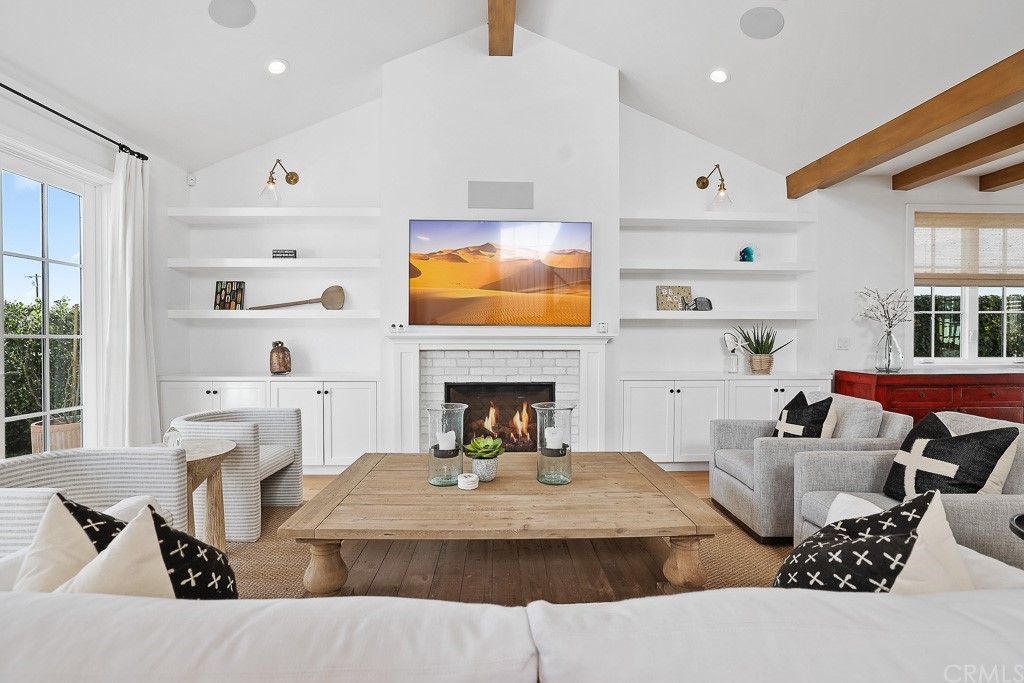 355 Rochester Street Costa Mesa, CA 92627 - Photo 8 of 34 a living room with furniture and a fireplace