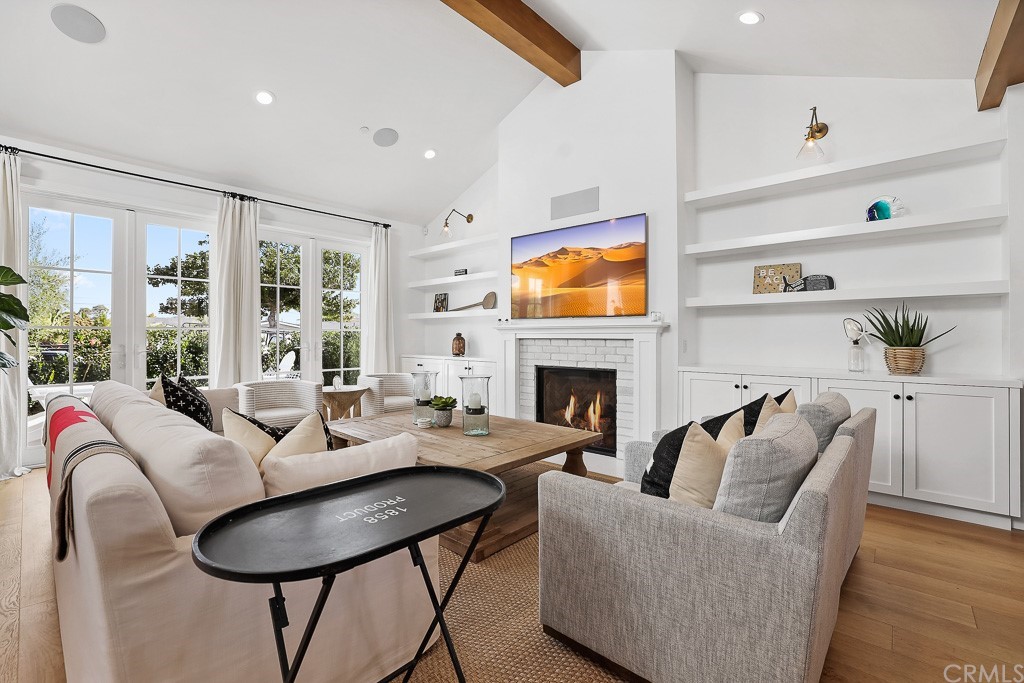 355 Rochester Street Costa Mesa, CA 92627 - Photo 9 of 34 a living room with furniture fireplace and flat screen tv