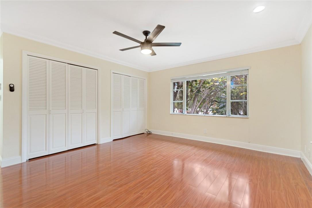 3420 Spring Bluff Place, Unit 39 Lauderhill, FL 33319 - Photo 17 of 32 wooden floor in an empty room with a window