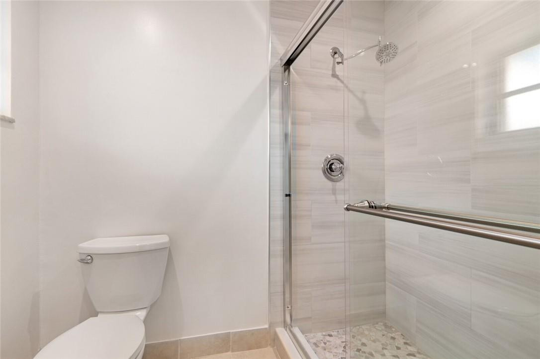 3420 Spring Bluff Place, Unit 39 Lauderhill, FL 33319 - Photo 20 of 32 a bathroom with a toilet and shower