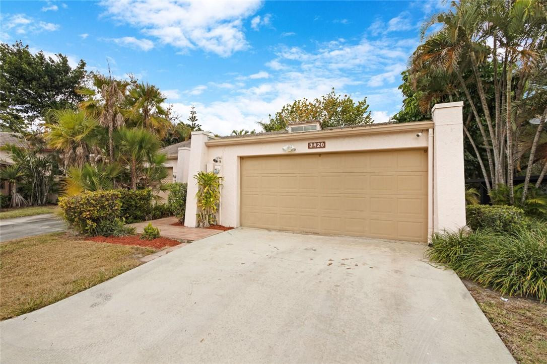 3420 Spring Bluff Place, Unit 39 Lauderhill, FL 33319 - Photo 31 of 32 front view of a house with a garage