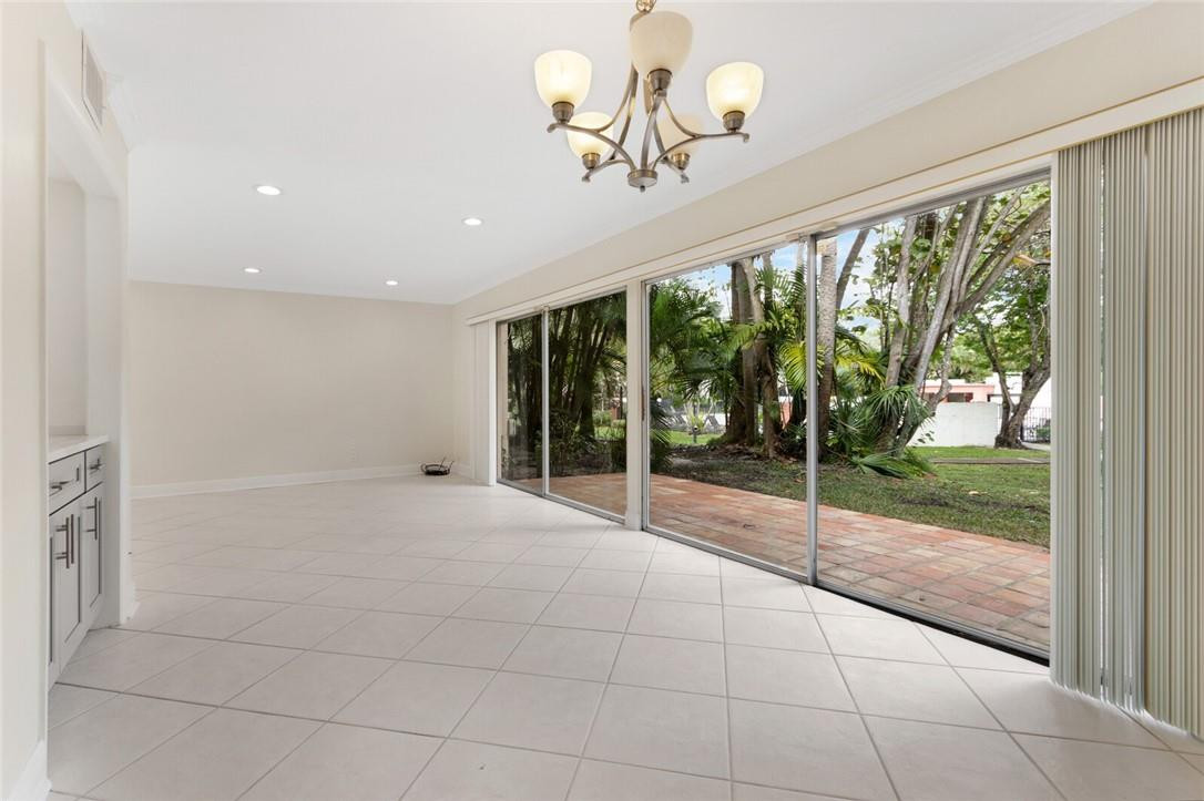 3420 Spring Bluff Place, Unit 39 Lauderhill, FL 33319 - Photo 5 of 32 a view of an empty room with glass door