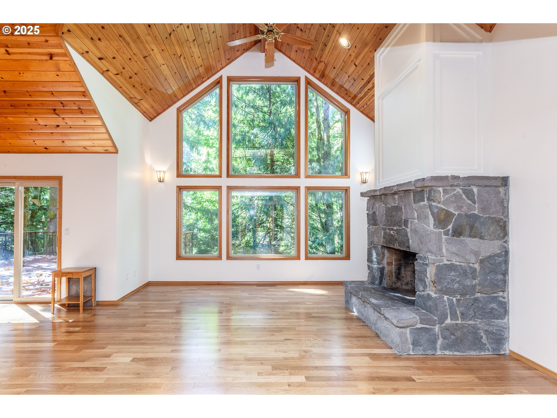 29409 East Edgewater Drive Welches, OR 97067 - Photo 12 of 48 a view of empty room with wooden floor and fireplace