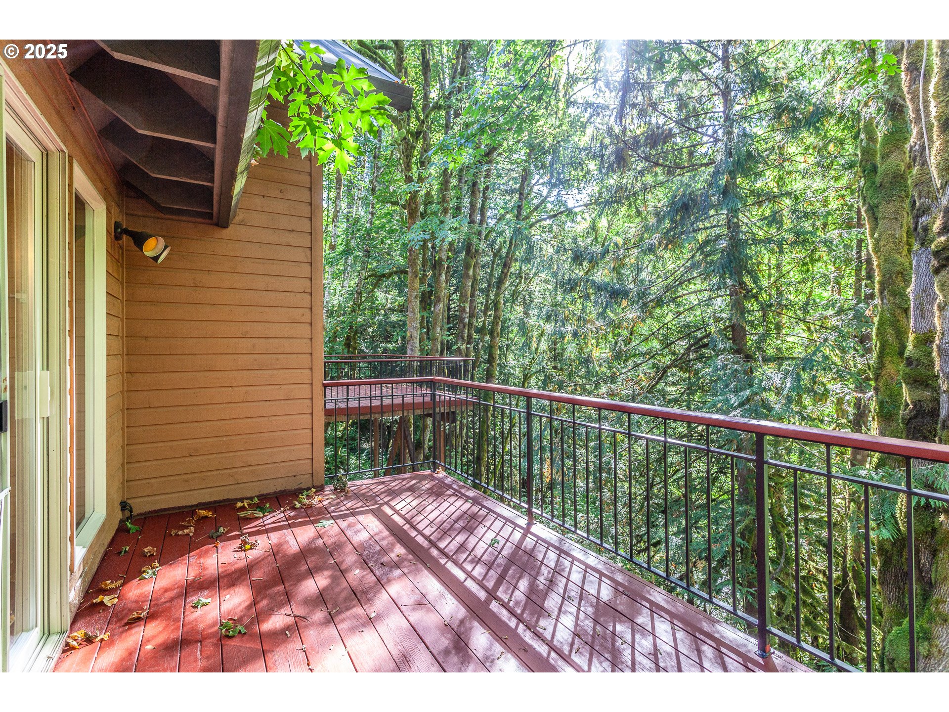 29409 East Edgewater Drive Welches, OR 97067 - Photo 26 of 48 a balcony with trees in front of it