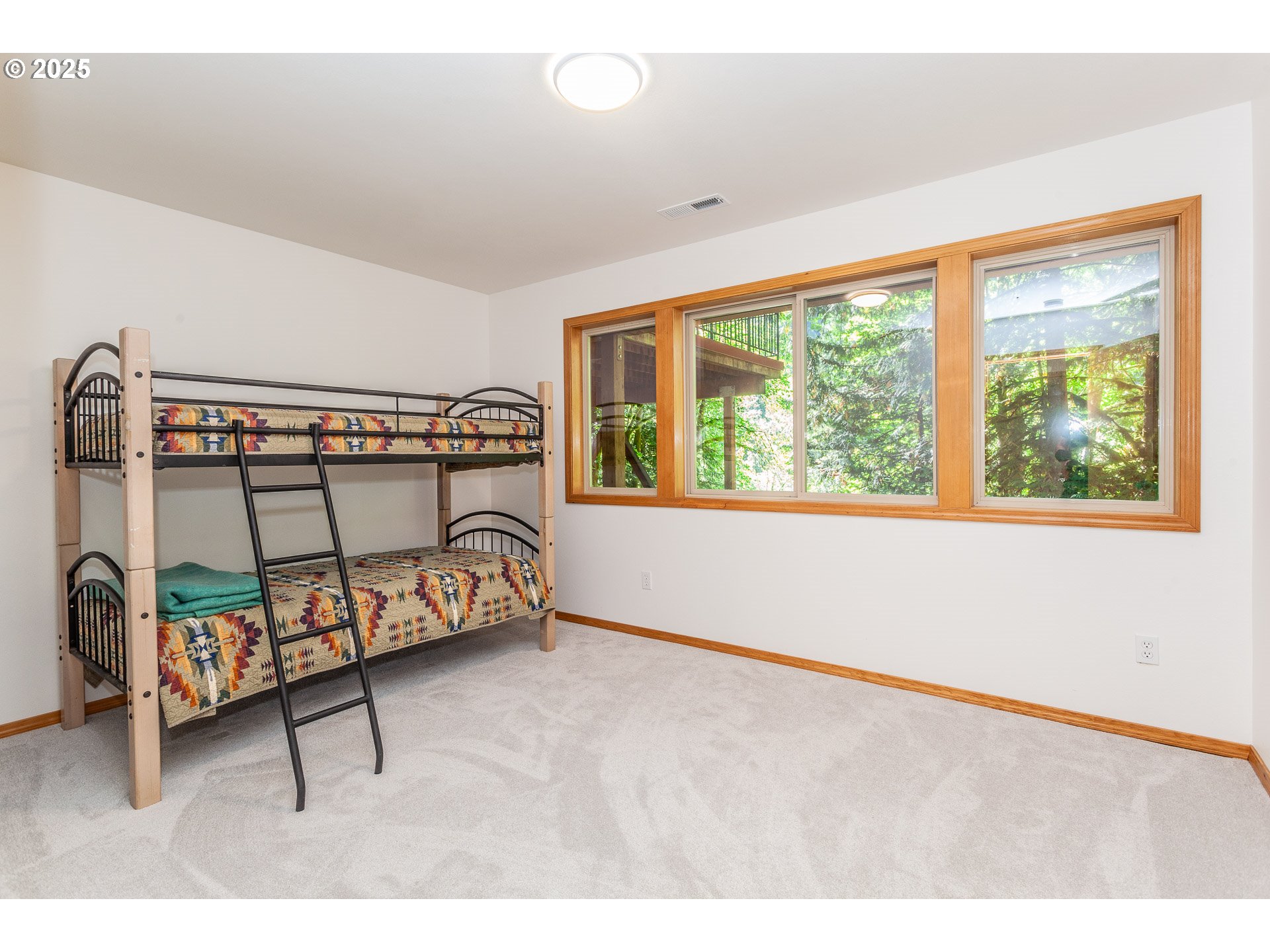 29409 East Edgewater Drive Welches, OR 97067 - Photo 29 of 48 a bedroom with furniture and a window