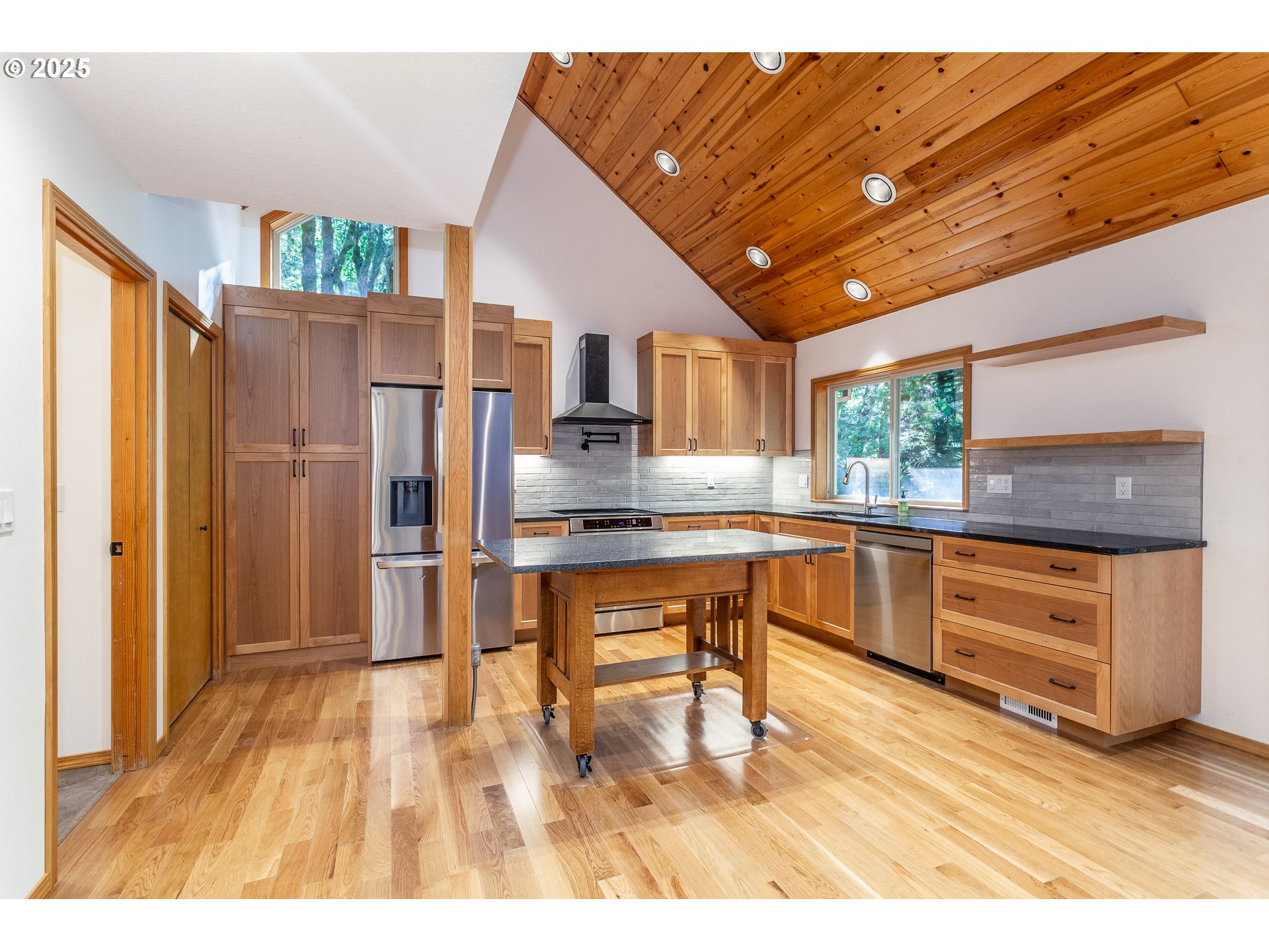 29409 East Edgewater Drive Welches, OR 97067 - Photo 6 of 48 a kitchen with stainless steel appliances granite countertop a refrigerator and a sink