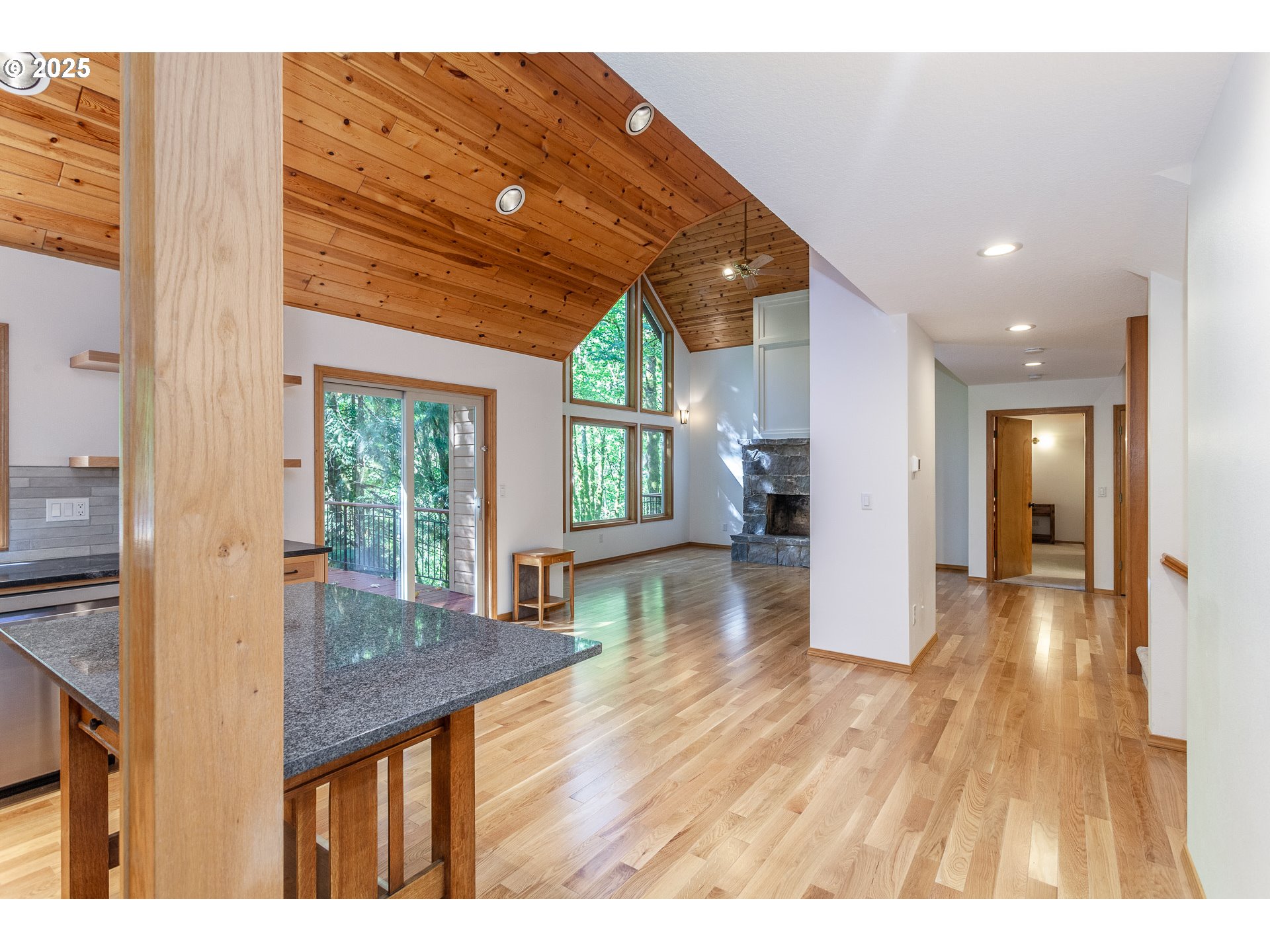 29409 East Edgewater Drive Welches, OR 97067 - Photo 9 of 48 a open kitchen with kitchen island wooden floors and center island
