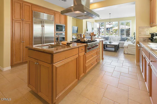 a spacious bedroom with a bed and a couch