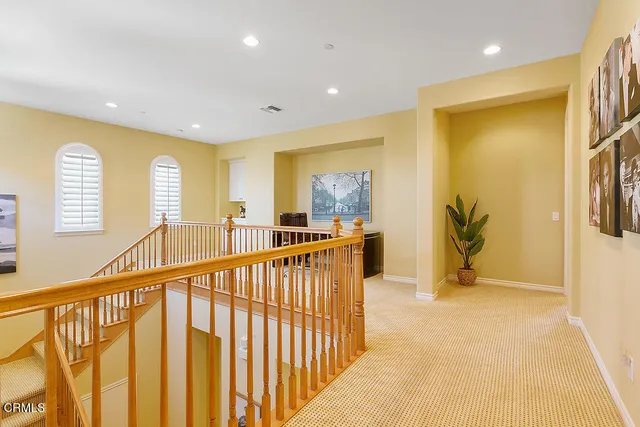 a spacious bathroom with a tub sink and mirror
