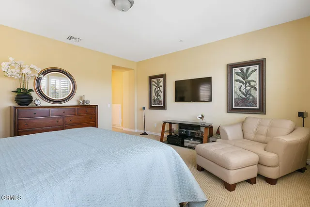 a spacious bathroom with a tub sink and mirror
