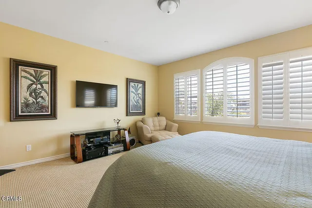 a spacious bathroom with a granite countertop sink mirror and bathtub