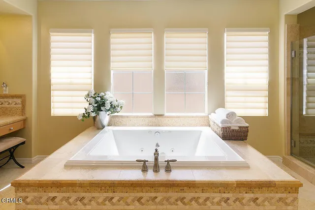 a en suite bathroom with a sink and a mirror
