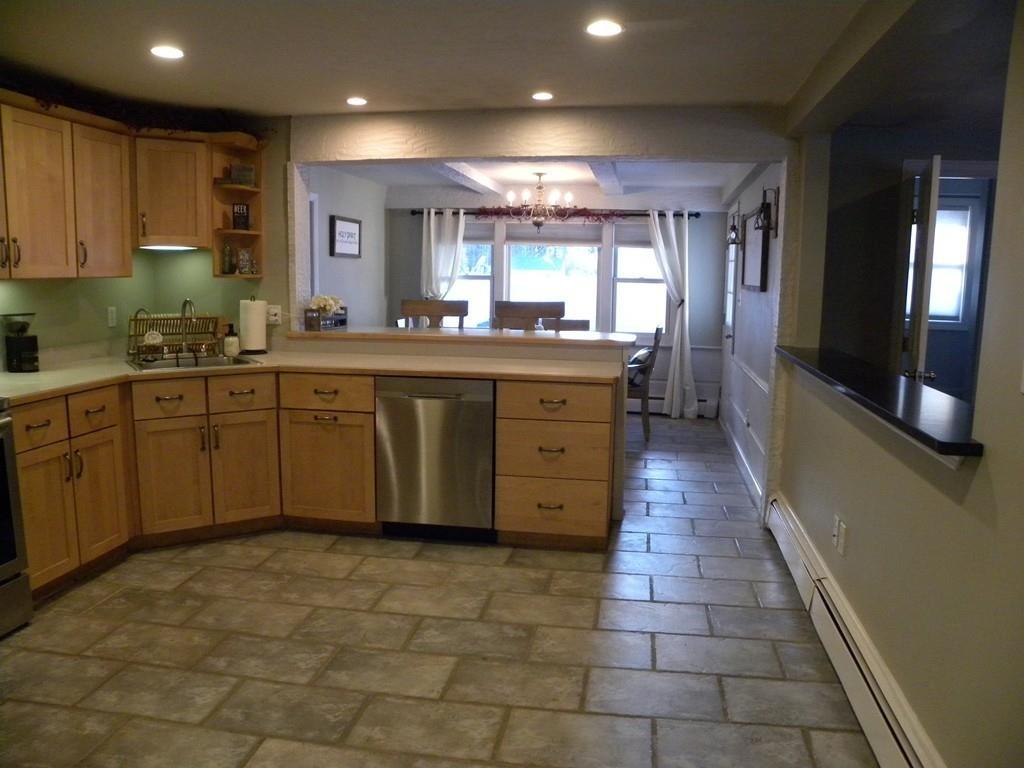 14 Samuel Road Chelmsford, MA 01824 - Photo 5 of 36 a large kitchen with stainless steel appliances granite countertop a sink and cabinets