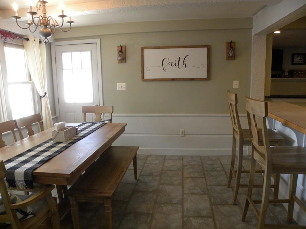 14 Samuel Road Chelmsford, MA 01824 - Photo 6 of 36 a room with a table chairs and a chandelier