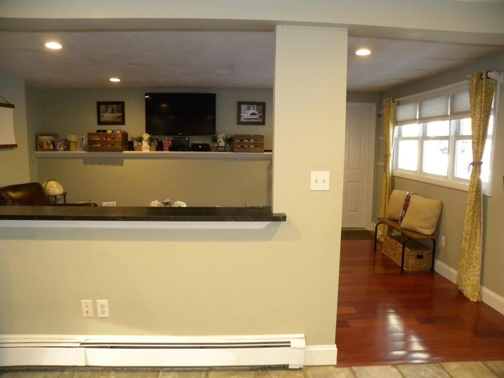 14 Samuel Road Chelmsford, MA 01824 - Photo 8 of 36 a view of kitchen with stainless steel appliances granite countertop a refrigerator a stove and a sink with wooden floor