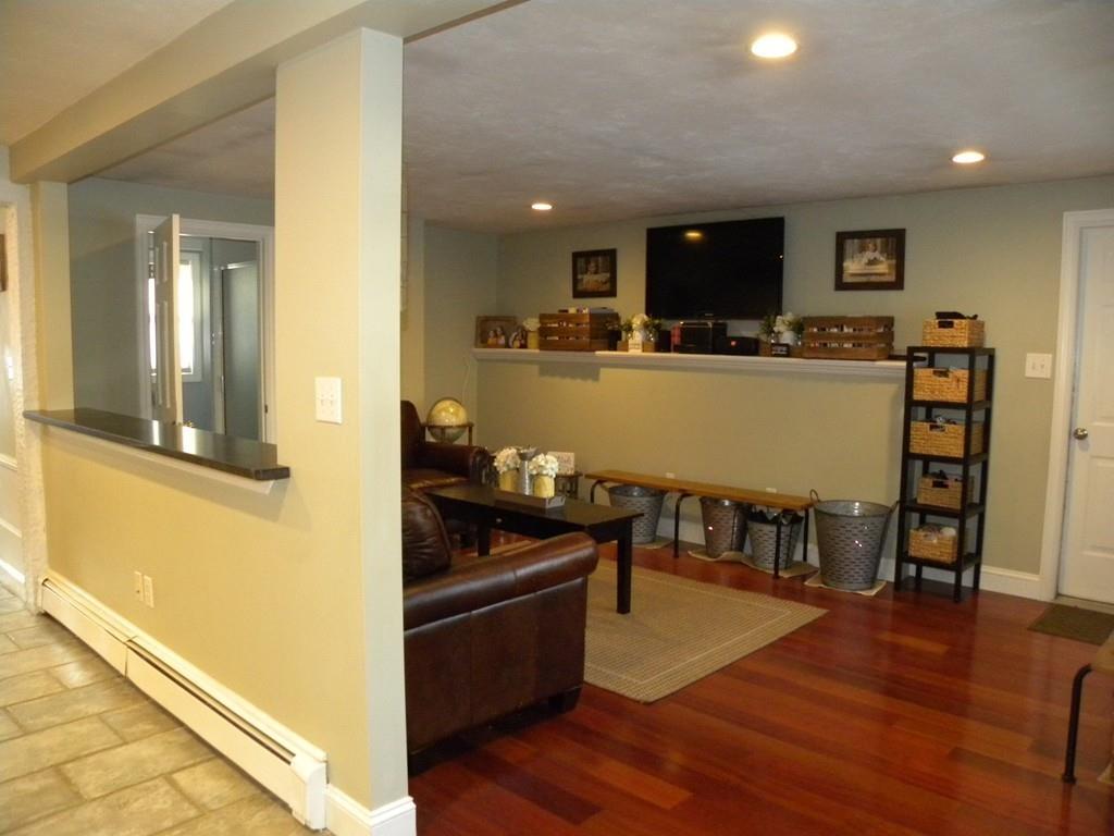 14 Samuel Road Chelmsford, MA 01824 - Photo 9 of 36 a kitchen with stainless steel appliances granite countertop a stove and a refrigerator