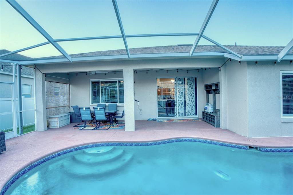 4303 Orange Ridge Court Valrico, FL 33596 - Photo 36 of 40 a view of a backyard with table and chairs and floor