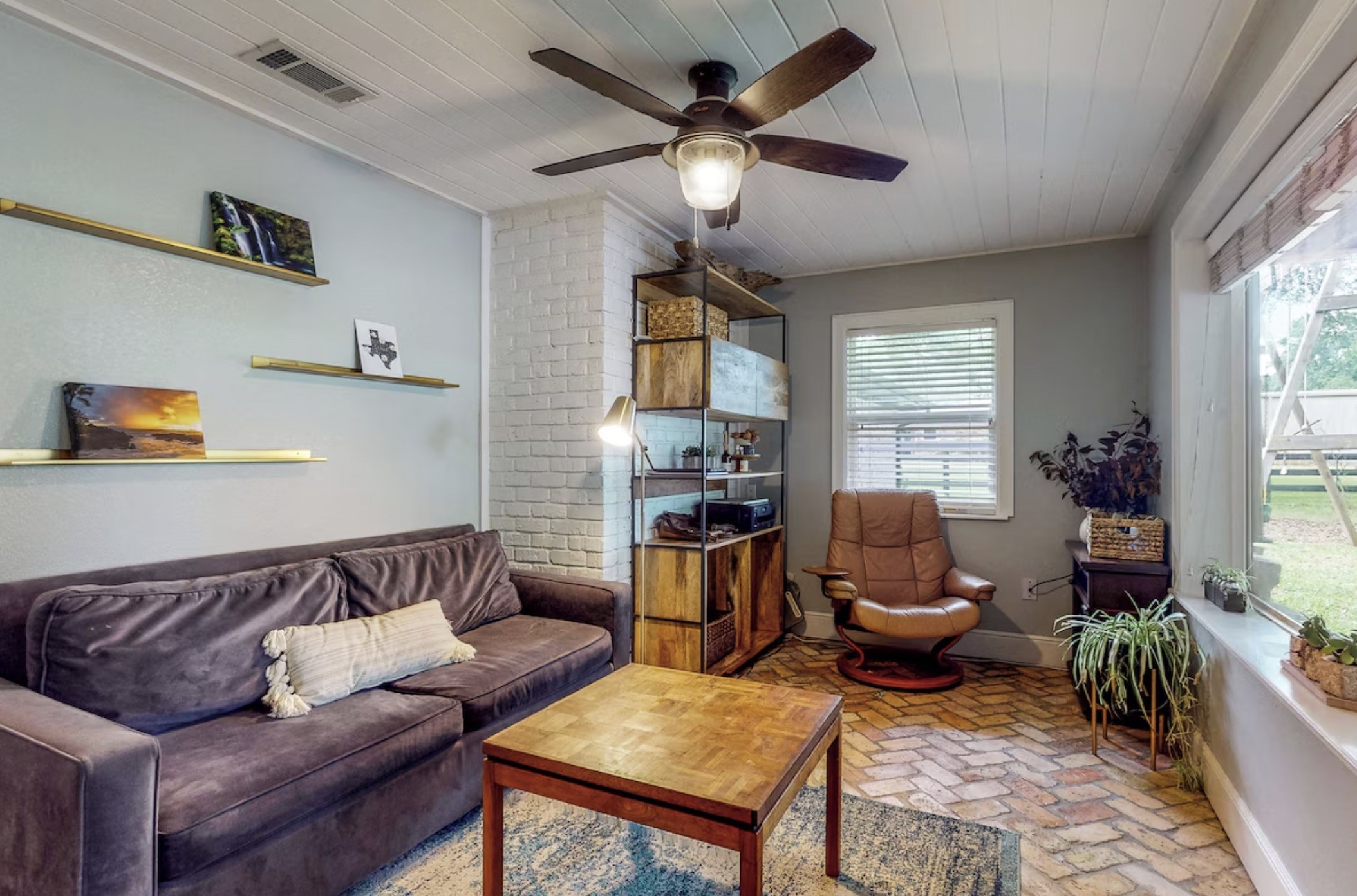 30819 Quinn Road Tomball, TX 77375 - Photo 22 of 30 a living room with furniture ceiling fan and a window