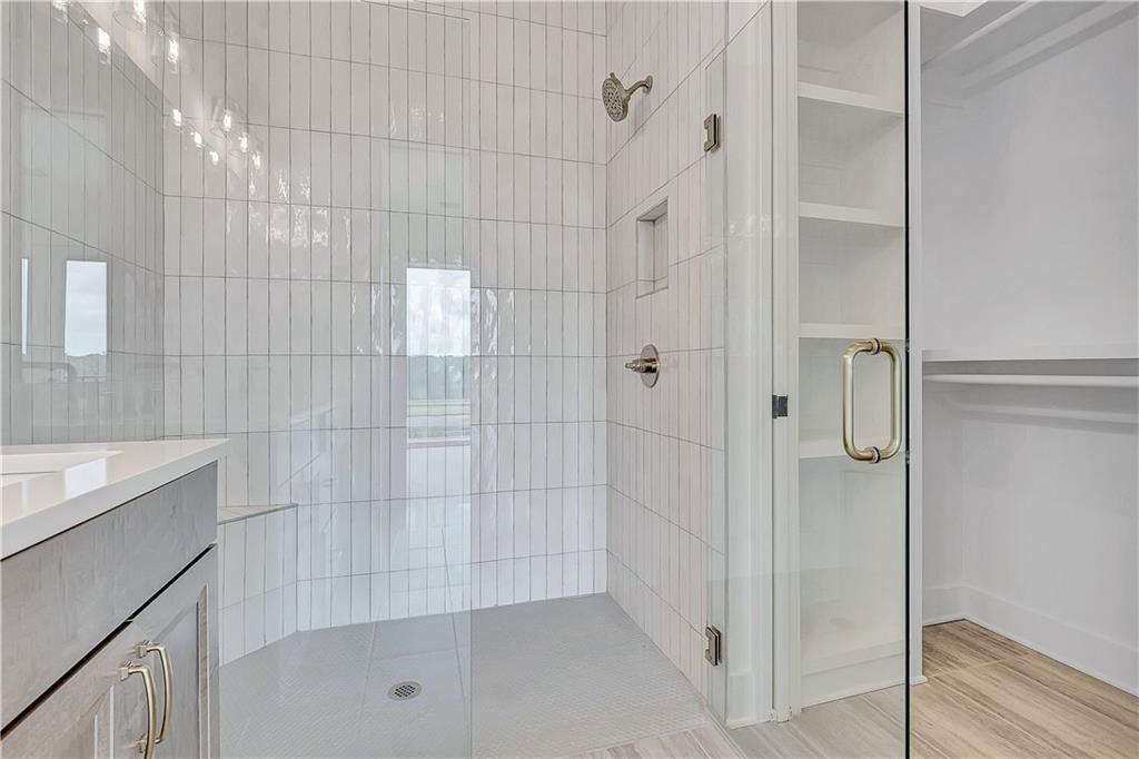 180 Rolison Way Fayetteville, GA 30214 - Photo 23 of 55 a bathroom with a shower and a sink