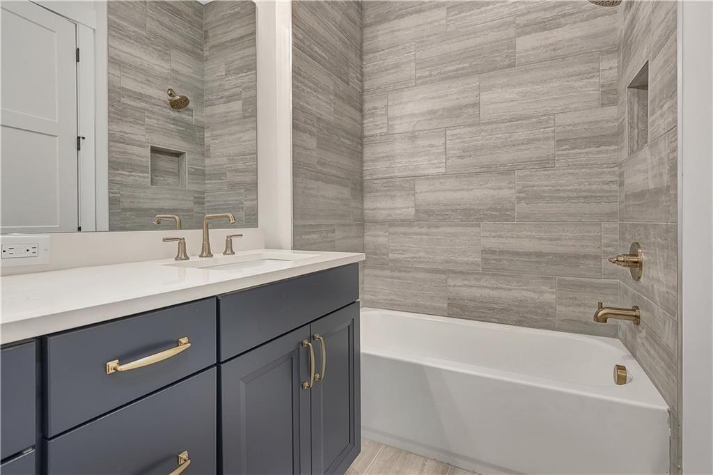 180 Rolison Way Fayetteville, GA 30214 - Photo 32 of 55 a bathroom with a bathtub and a sink