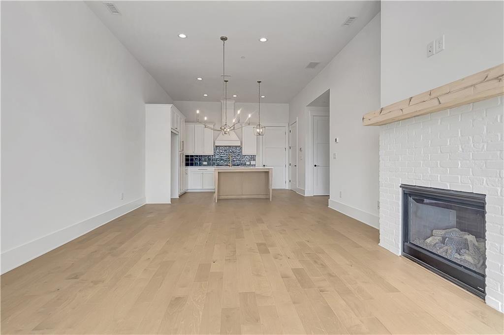 180 Rolison Way Fayetteville, GA 30214 - Photo 4 of 55 a view of a kitchen with a sink and a refrigerator