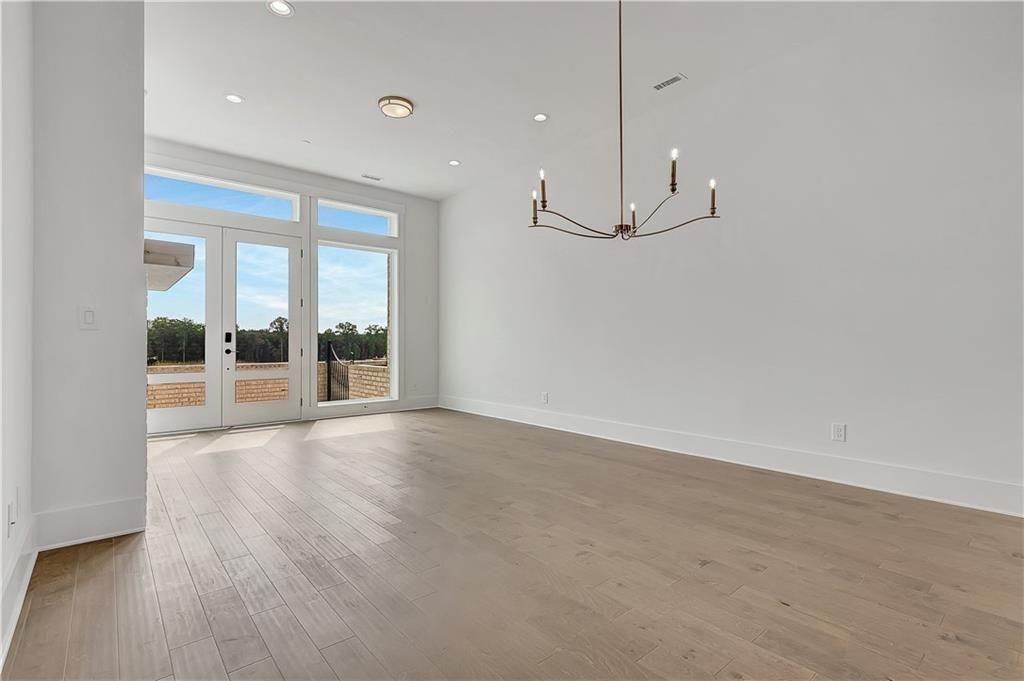 180 Rolison Way Fayetteville, GA 30214 - Photo 8 of 55 a view of a room with wooden floor and windows