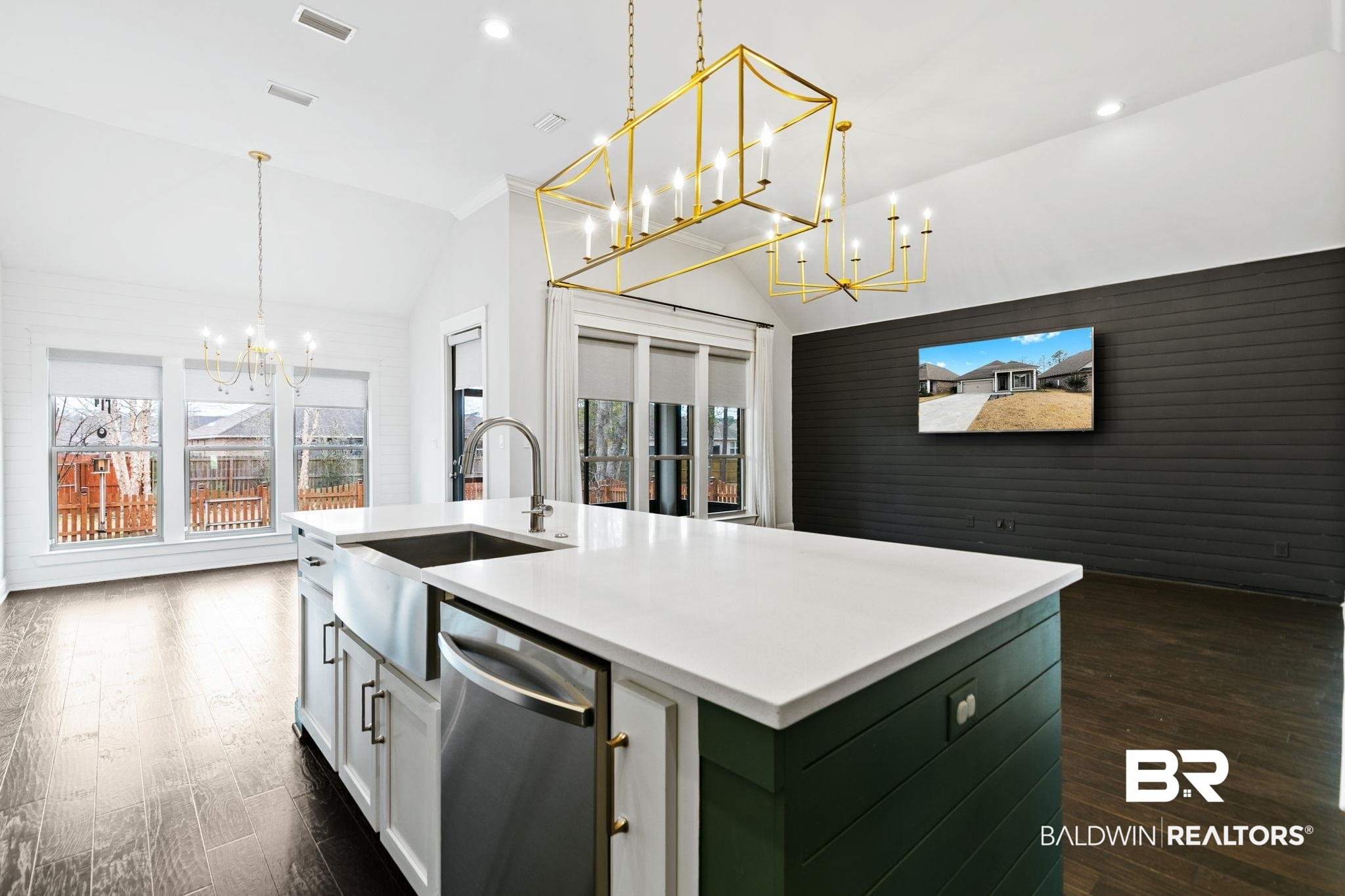 31654 Canopy Loop Daphne, AL 36527 - Photo 16 of 64 Kitchen featuring a chandelier, a center island with sink, dishwasher, lofted ceiling, and dark wood-type flooring