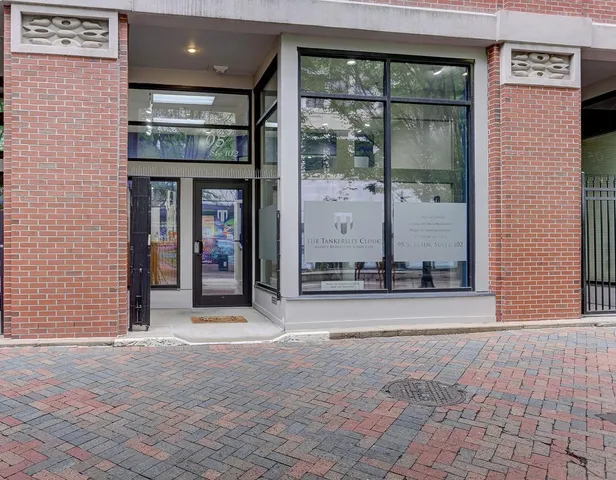 a view of a brick house with a large windows