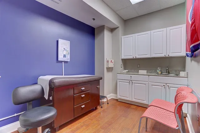 a bedroom with a bed and furniture