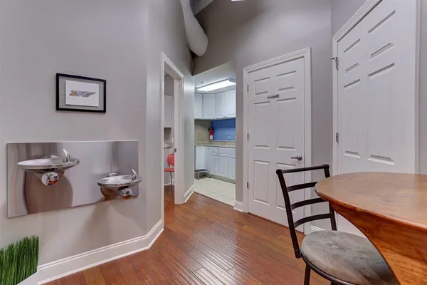 a kitchen with stainless steel appliances granite countertop a sink and cabinets