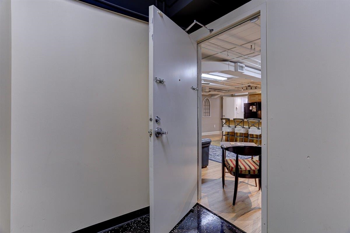95 South Main Street, Unit 102 Memphis, TN 38103 - Photo 31 of 35 a view of a hallway with wooden floor and a bathroom