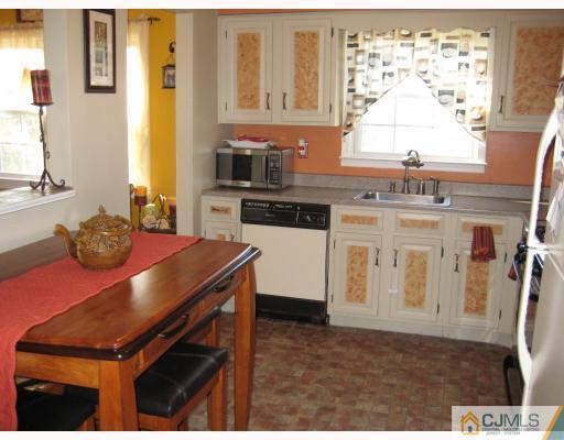 1 Birch Road Edison, NJ 08817 - Photo 4 of 10 a kitchen with a stove and a microwave