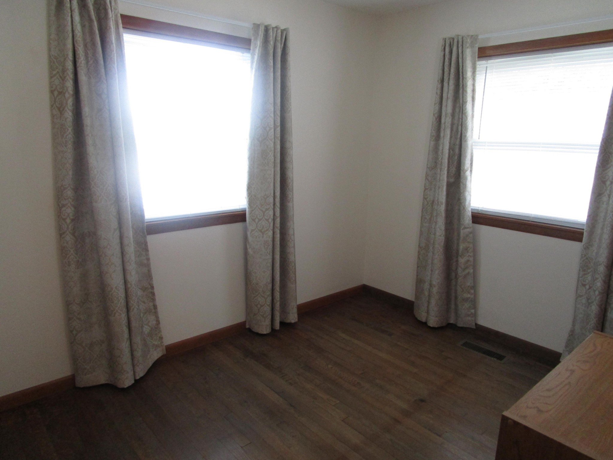 102 Darwin Lane Oak Ridge, TN 37830 - Photo 16 of 19 an empty room with wooden floor and windows