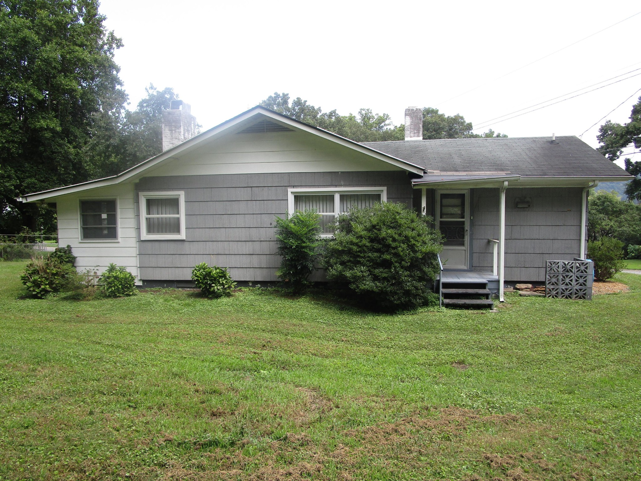 102 Darwin Lane Oak Ridge, TN 37830 - Photo 18 of 19 a house that is sitting in the grass