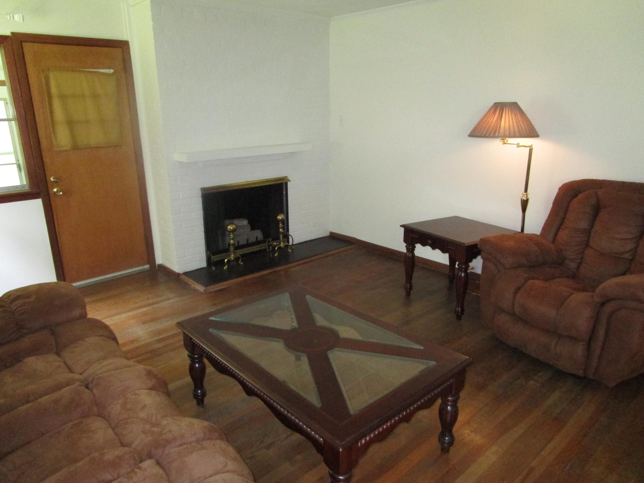 102 Darwin Lane Oak Ridge, TN 37830 - Photo 8 of 19 a living room with furniture a rug and a fireplace