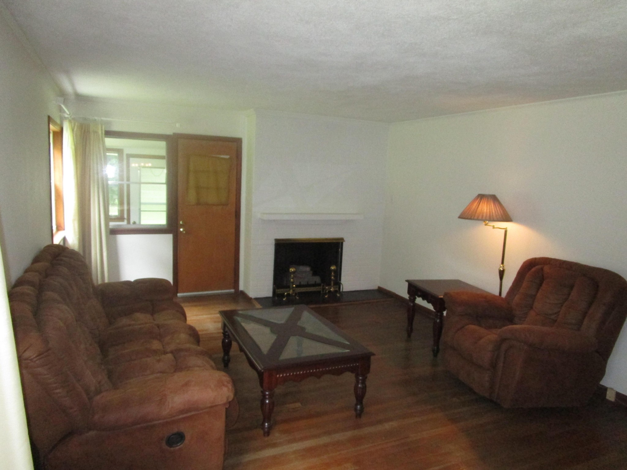 102 Darwin Lane Oak Ridge, TN 37830 - Photo 9 of 19 a living room with furniture and a fireplace