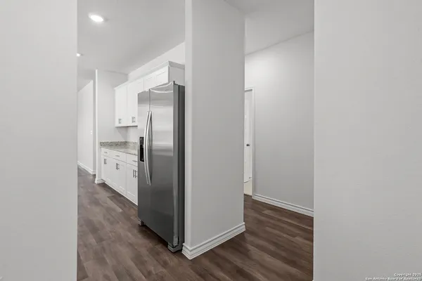 a view of a kitchen with wooden floor