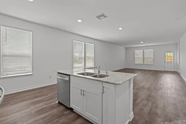a kitchen with sink and window
