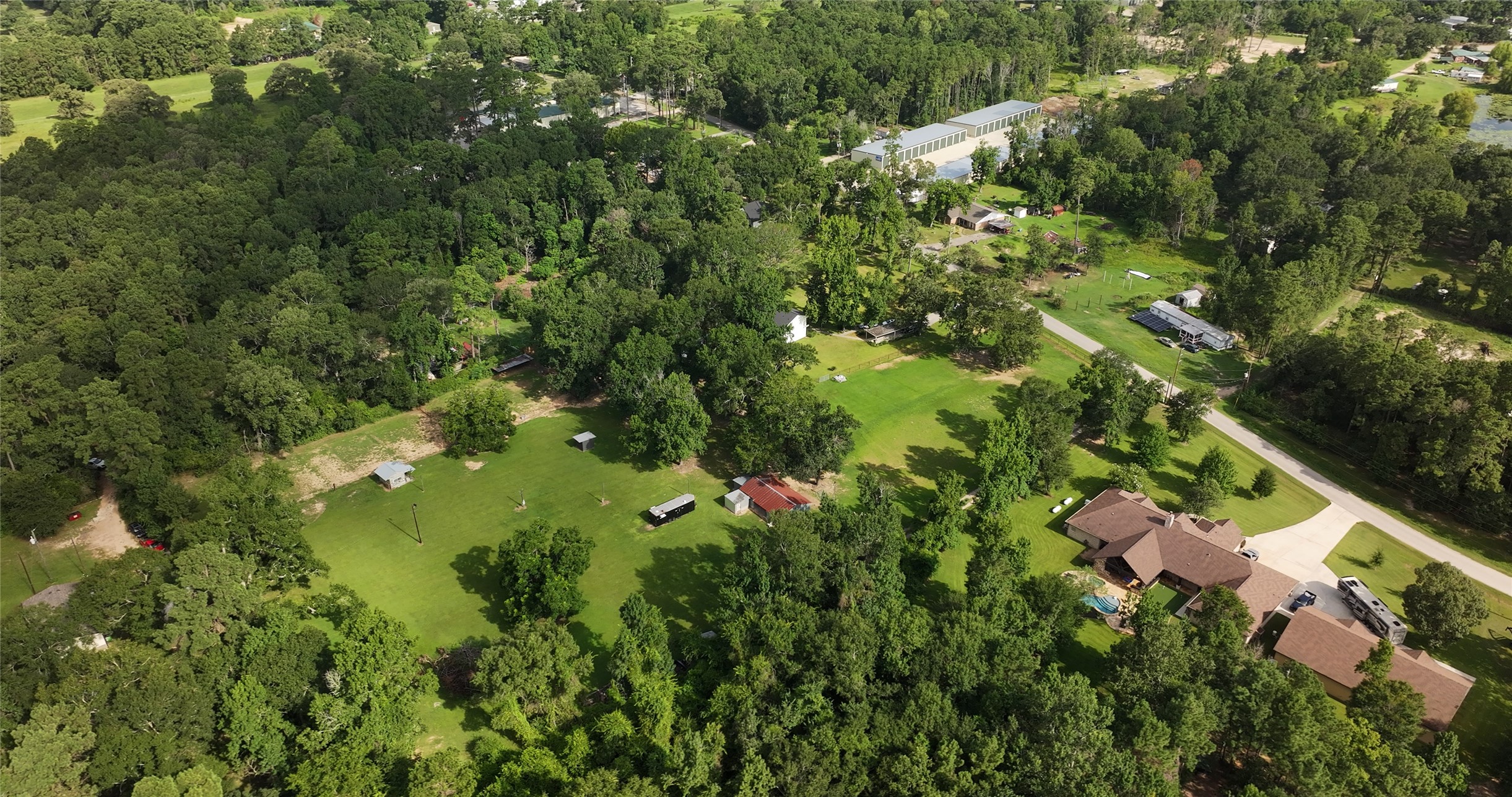 11291 Darby Loop Conroe, TX 77385 - Photo 17 of 18 an aerial view of residential houses with outdoor space and trees all around