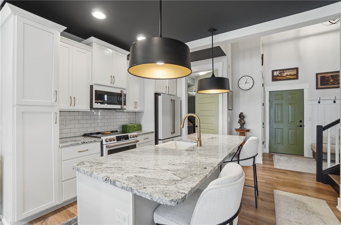 605 Cape Cod Court Beavercreek, OH 45430 - Photo 10 of 54 This bright kitchen features sleek appliances and a spacious island, perfect for culinary endeavors.