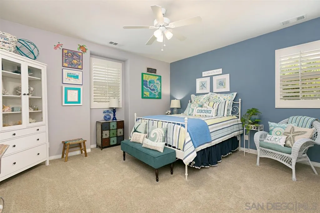 6991 Goldstone Road Carlsbad, CA 92009 - Photo 12 of 25 a bedroom with a bed and a window