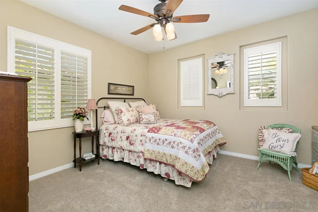 6991 Goldstone Road Carlsbad, CA 92009 - Photo 13 of 25 a bedroom with a bed and a window
