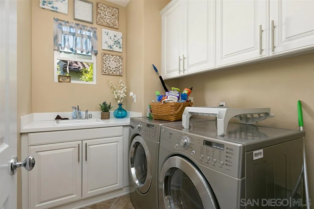 6991 Goldstone Road Carlsbad, CA 92009 - Photo 18 of 25 a utility room with dryer and washer