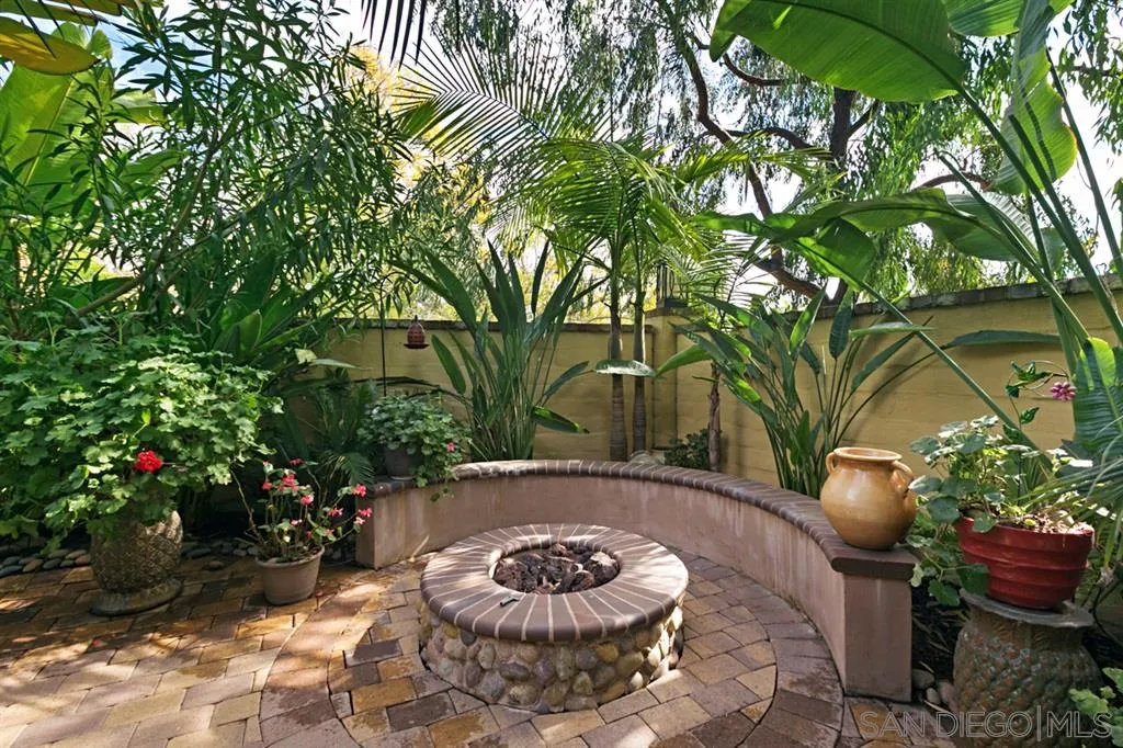 6991 Goldstone Road Carlsbad, CA 92009 - Photo 22 of 25 a view of a backyard with plants and a patio